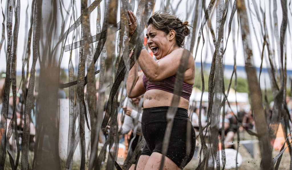 Tough Mudder Chicago participants tackling an obstacle