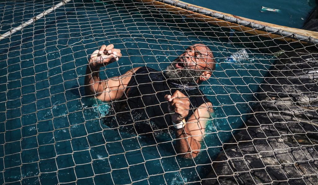 Tough Mudder Los Angeles participants tackling an obstacle