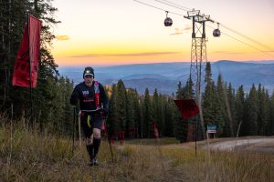 A 29029 Everesting participant climbing a marked course at sunrise