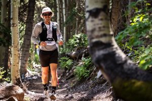 A runner on singletrack at 29029 TRAIL Park City