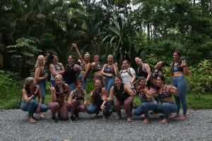 Group of Ruck & Flow retreat participants gathered on a jungle road in Costa Rica