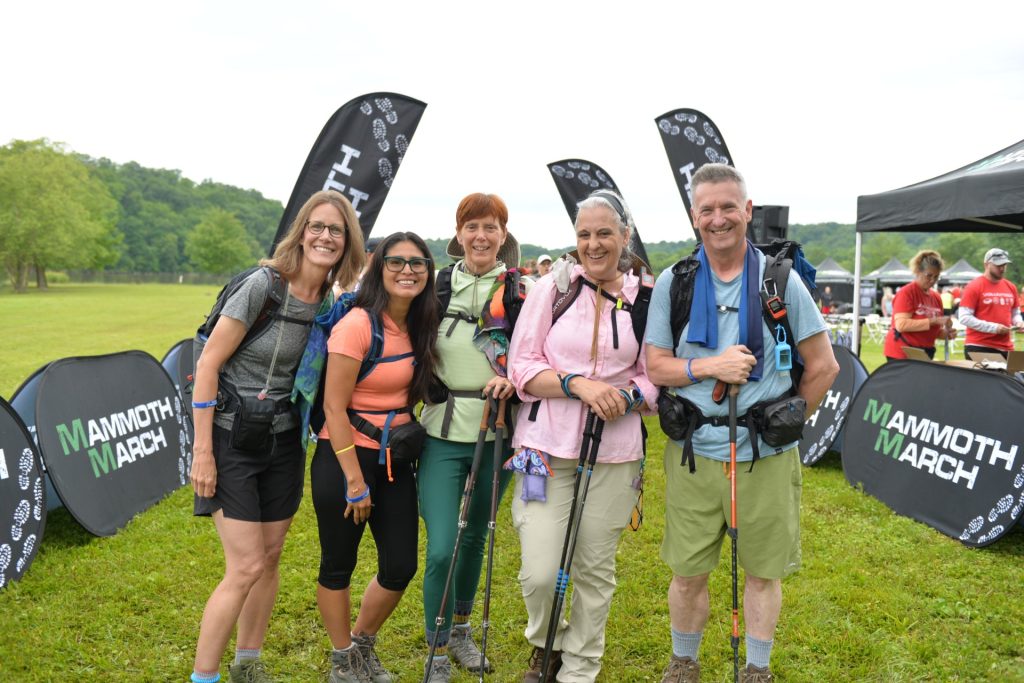 A group of hikers with backpacks and trekking poles at the Mammoth March Indiana start