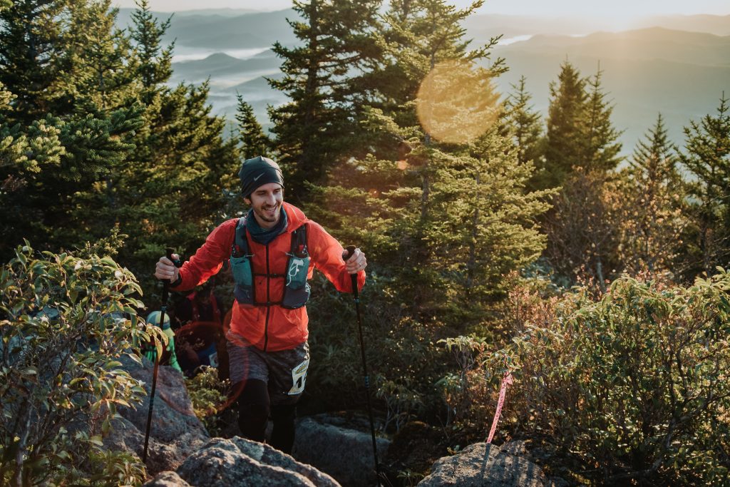Runner on a steep green mountain trail in the Black Mountains of North Carolina