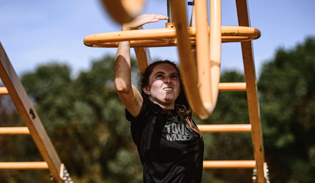 Tough Mudder participants on an obstacle course at a past event